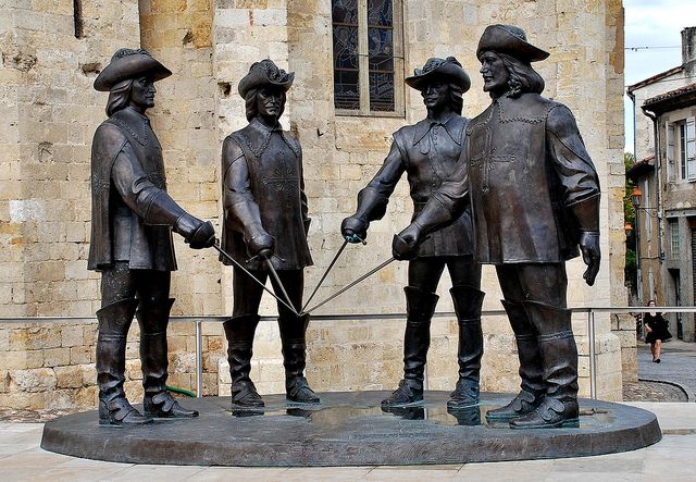 Statue of the four Musketeers in the centre of Condom...